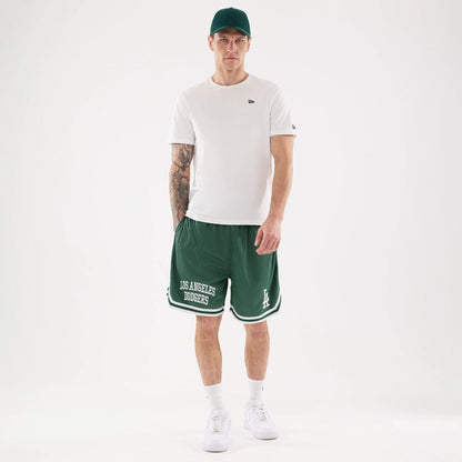 The model is wearing this MLB Comfort LA Dodgers Oversized Shorts in Dark Green. 8