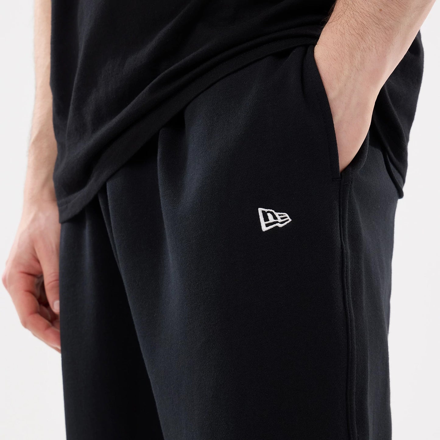 The model is wearing this New Era Straight Legged Joggers in black. 6