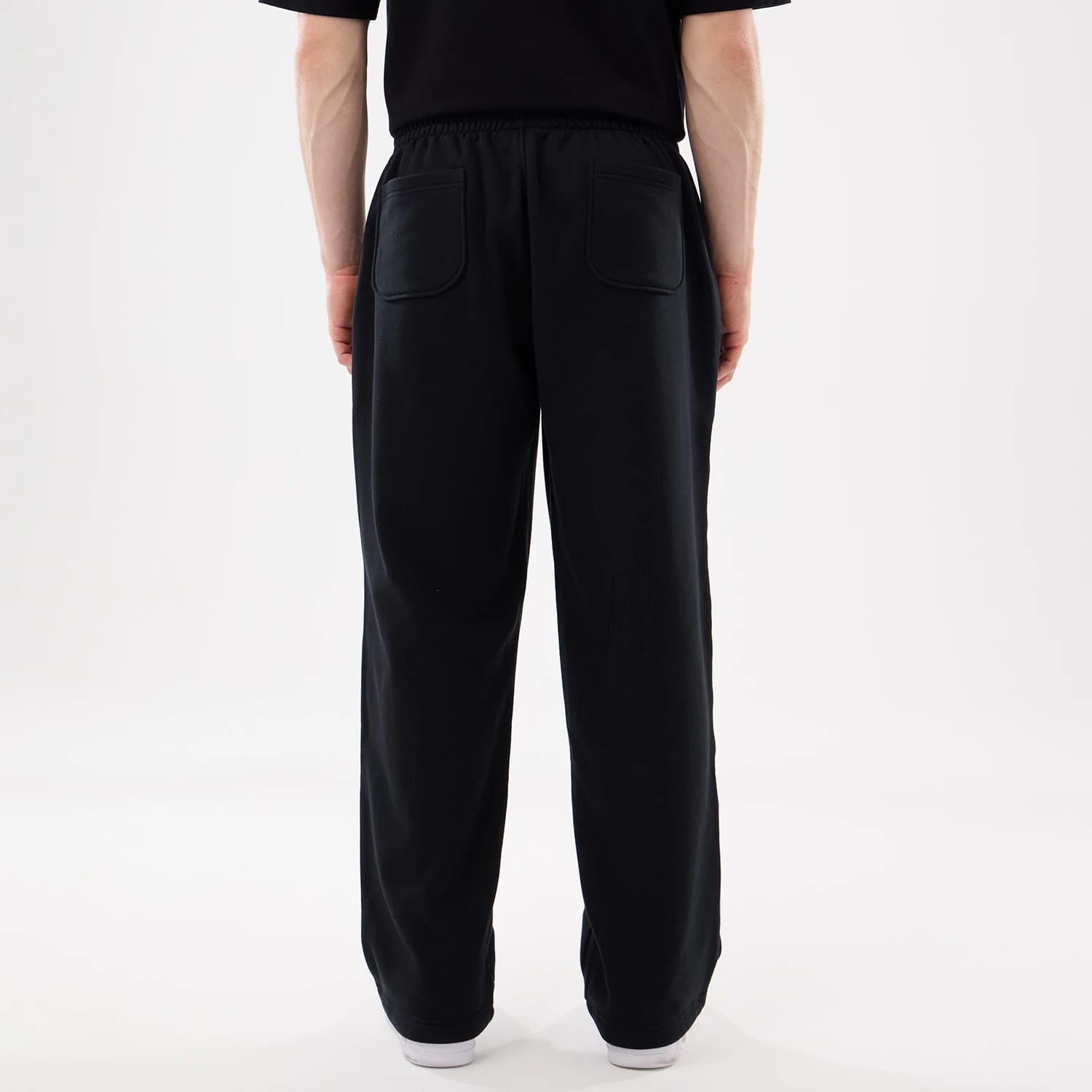 The model is wearing this New Era Straight Legged Joggers in black. 2