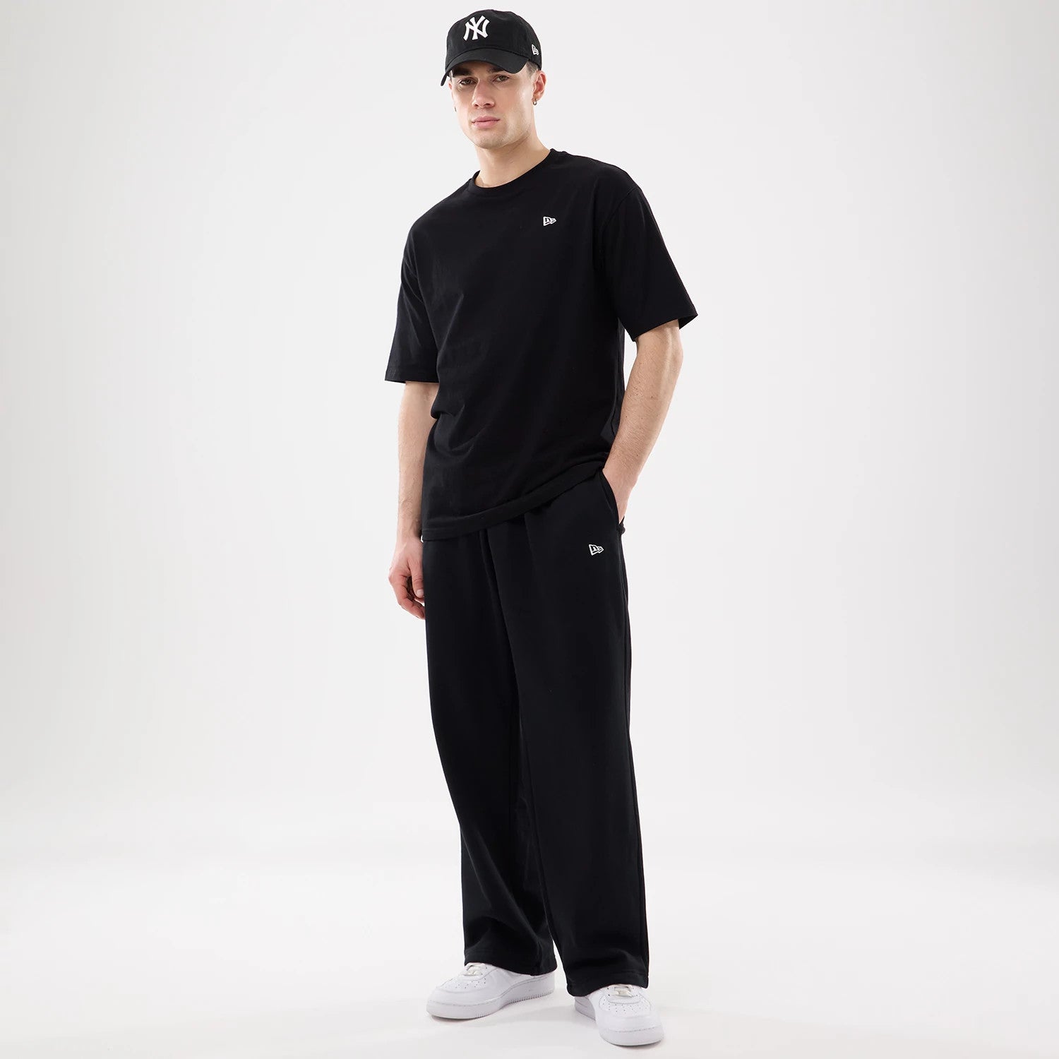 The model is wearing this New Era Straight Legged Joggers in black. 7