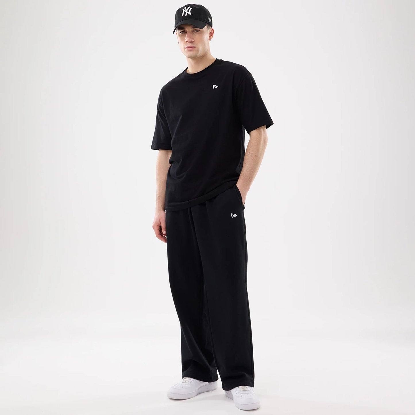 The model is wearing this New Era Straight Legged Joggers in black. 7