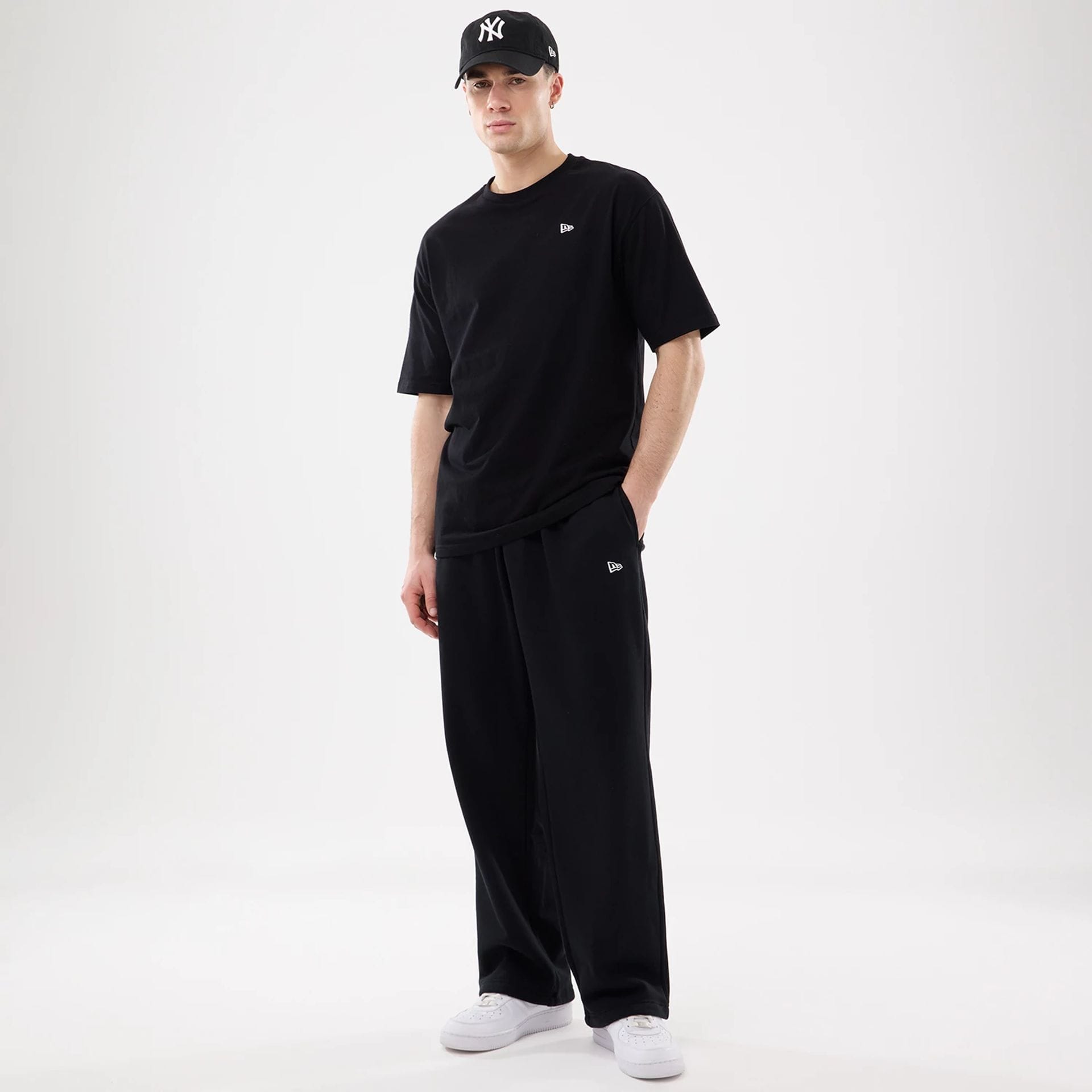 The model is wearing this New Era Straight Legged Joggers in black. 7