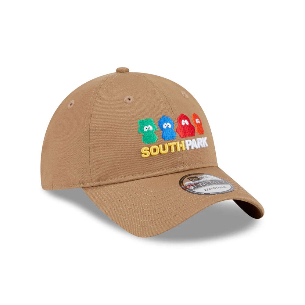 South Park Brown New Era 9TWENTY Adjustable Cap, three-quarter view showing raised embroidery of colourful characters and "South Park" text on the front panel, curved visor with 9TWENTY size sticker, and matching brown top button.