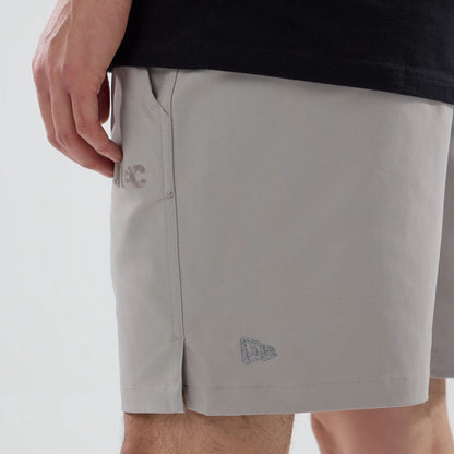 The model is wearing this New Era Urban Core Oversized Shorts in Beige . 4