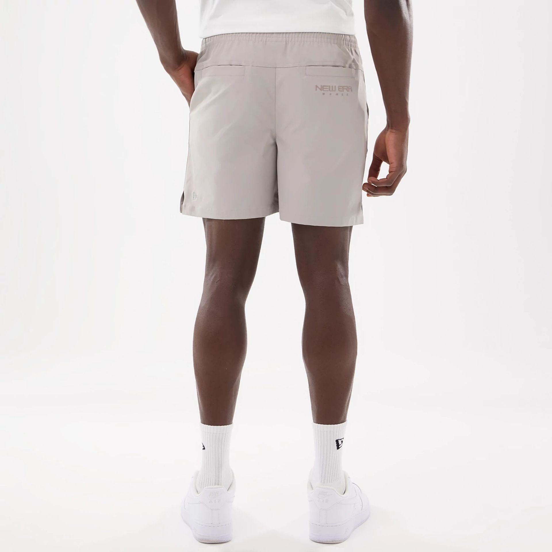 The model is wearing this New Era Urban Core Oversized Shorts in Beige . 7