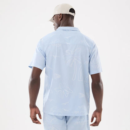 The model is wearing this New Era Resort Short Sleeve Shirt in blue. 2