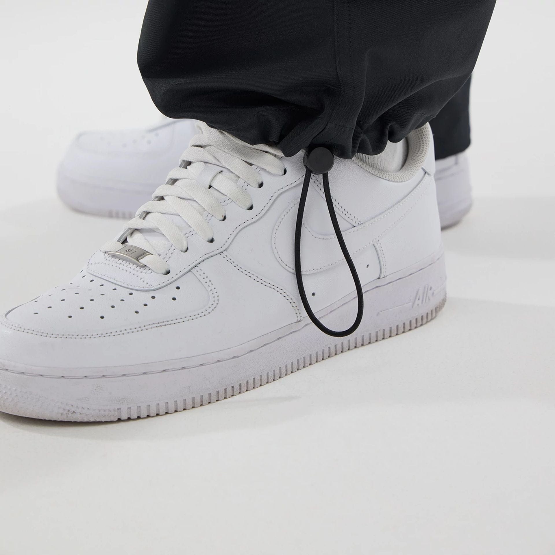 The model is wearing this New Era Urban Core Straight Leg Joggers in black. 7