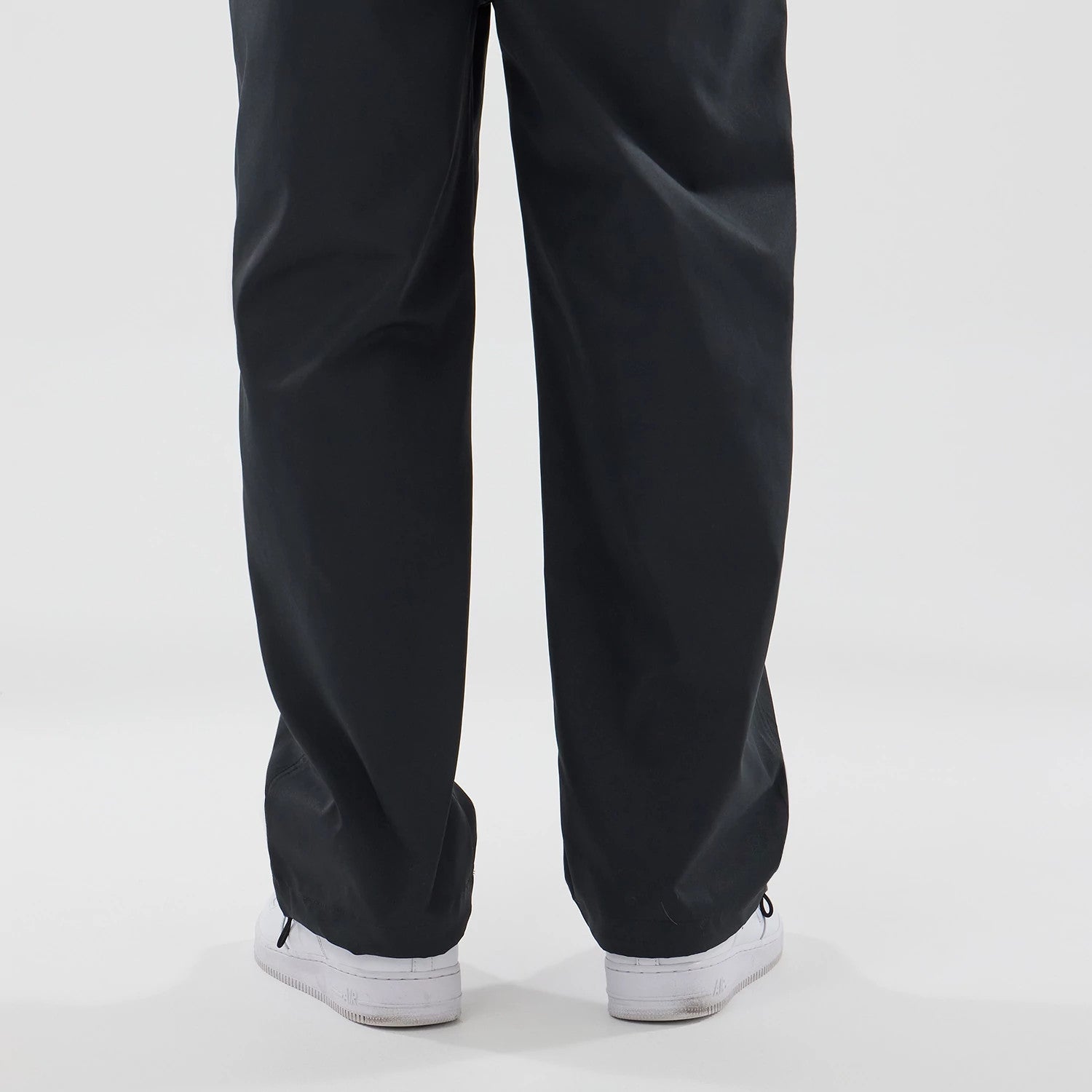 The model is wearing this New Era NEC Logo Straight Leg Joggers in black. 6
