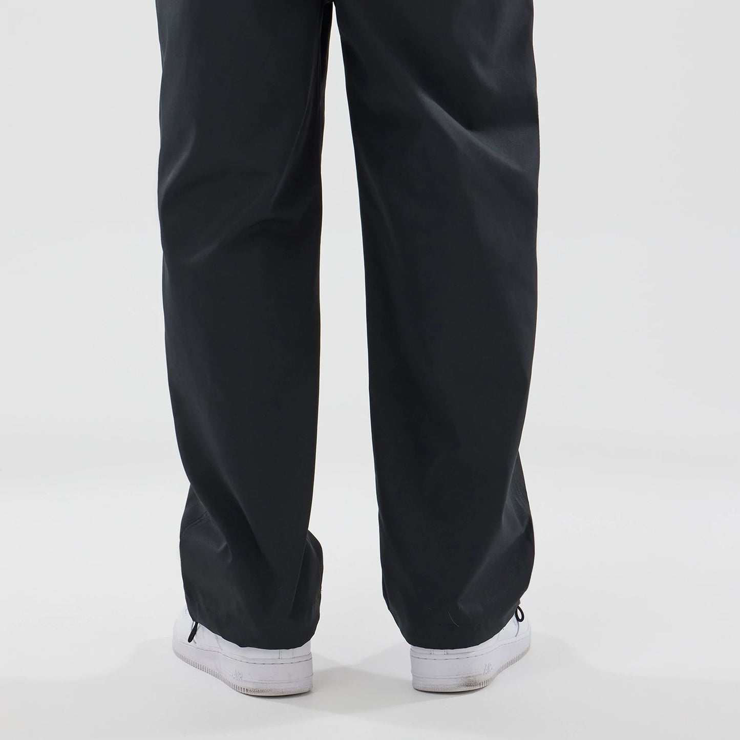 The model is wearing this New Era NEC Logo Straight Leg Joggers in black. 6