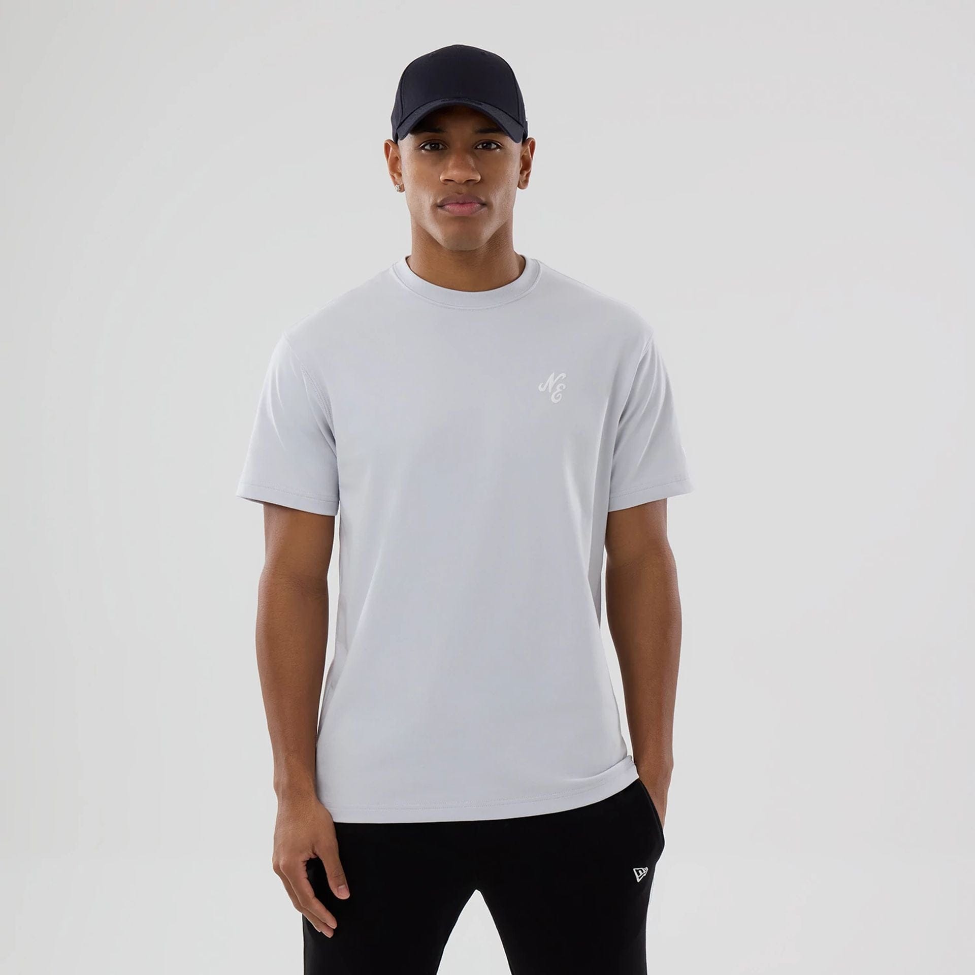 The model is wearing this New Era Zodiac Sign T-Shirt in silver. 1