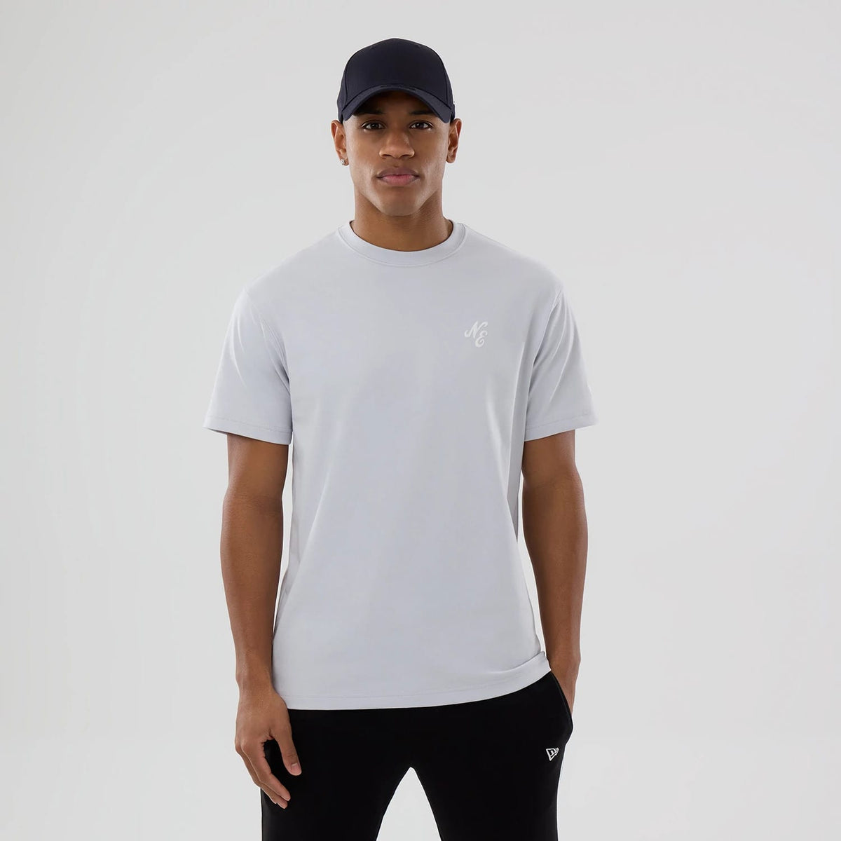 The model is wearing this New Era Zodiac Sign T-Shirt in silver. 1
