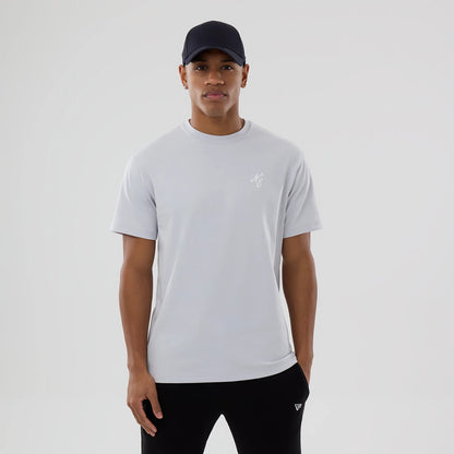 The model is wearing this New Era Zodiac Sign T-Shirt in silver. 1