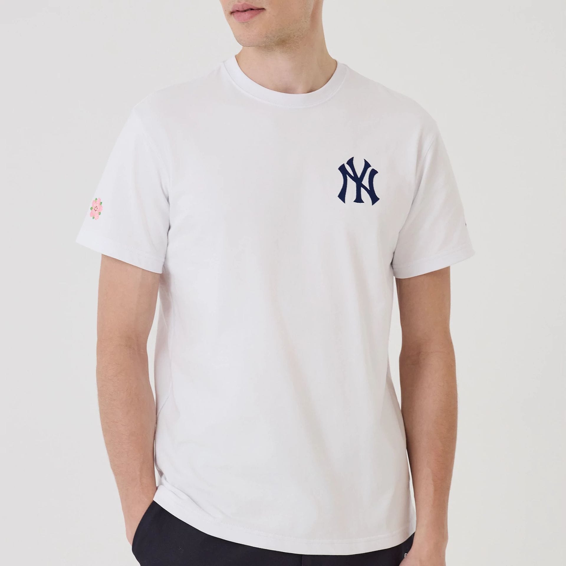 The model is wearing this MLB Sakura New York Yankees T-Shirt in white. 7