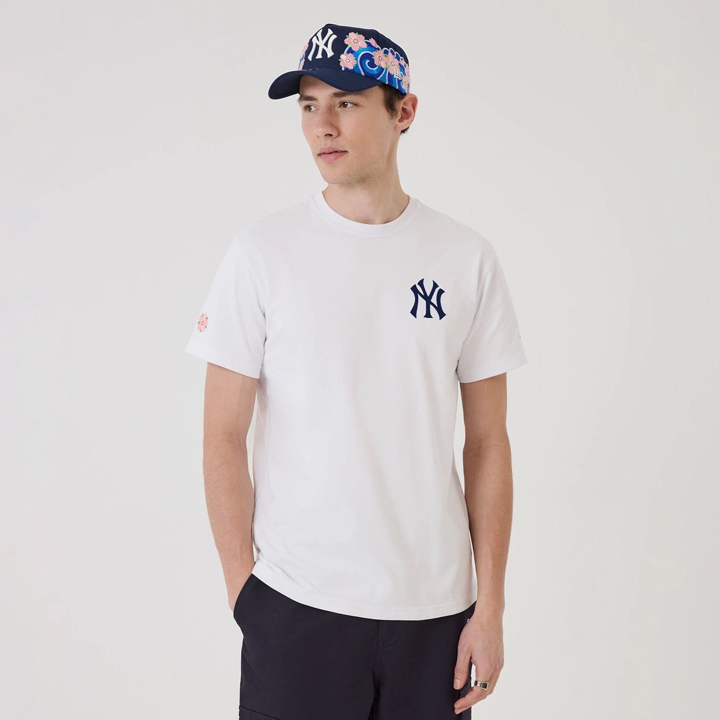 The model is wearing this MLB Sakura New York Yankees T-Shirt in white. 1