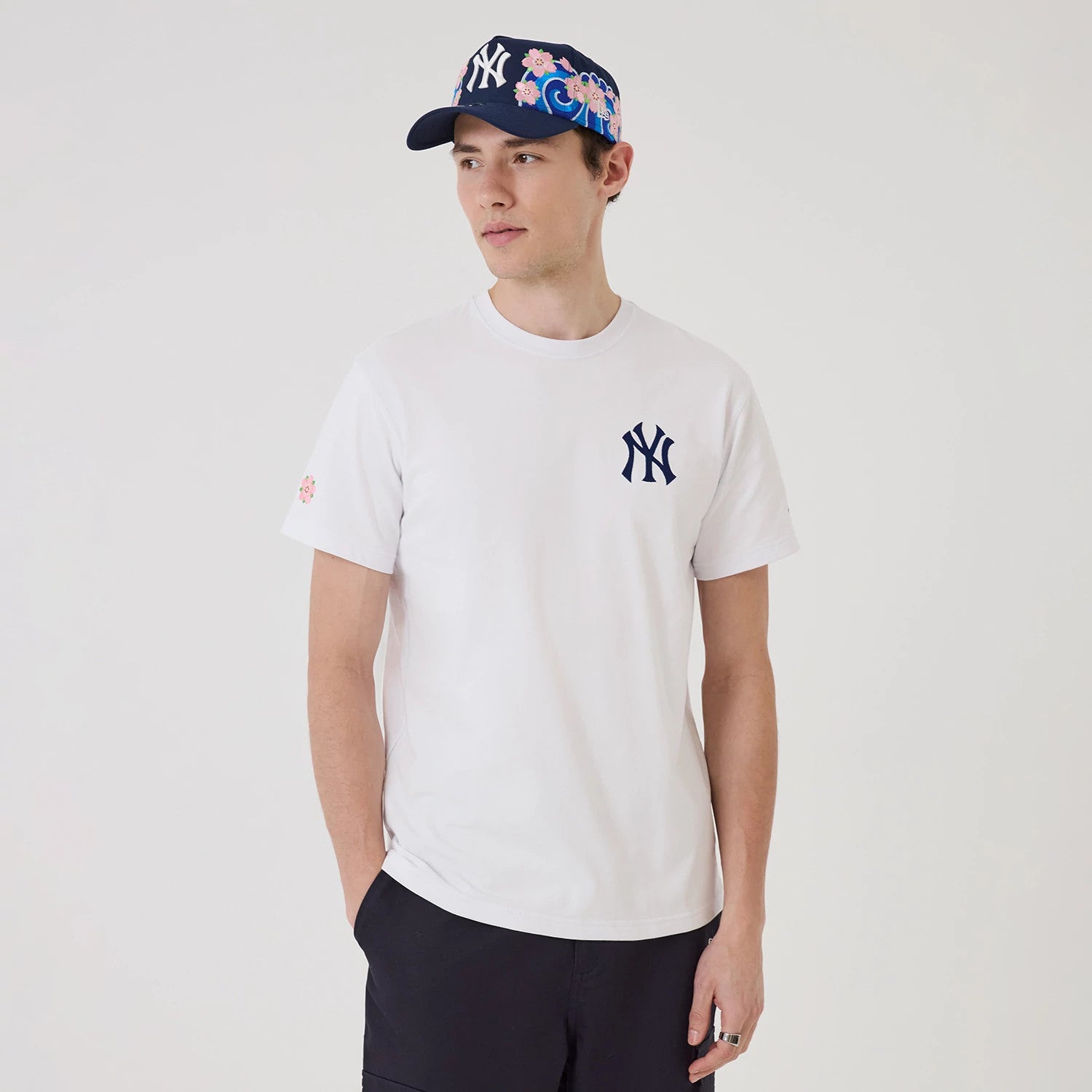 The model is wearing this MLB Sakura New York Yankees T-Shirt in white. 1