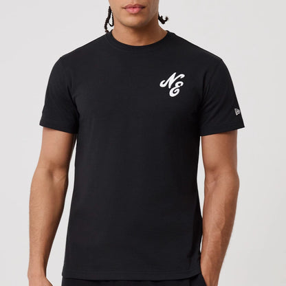 The model is wearing this New Era Sakura T-Shirt in black. 4