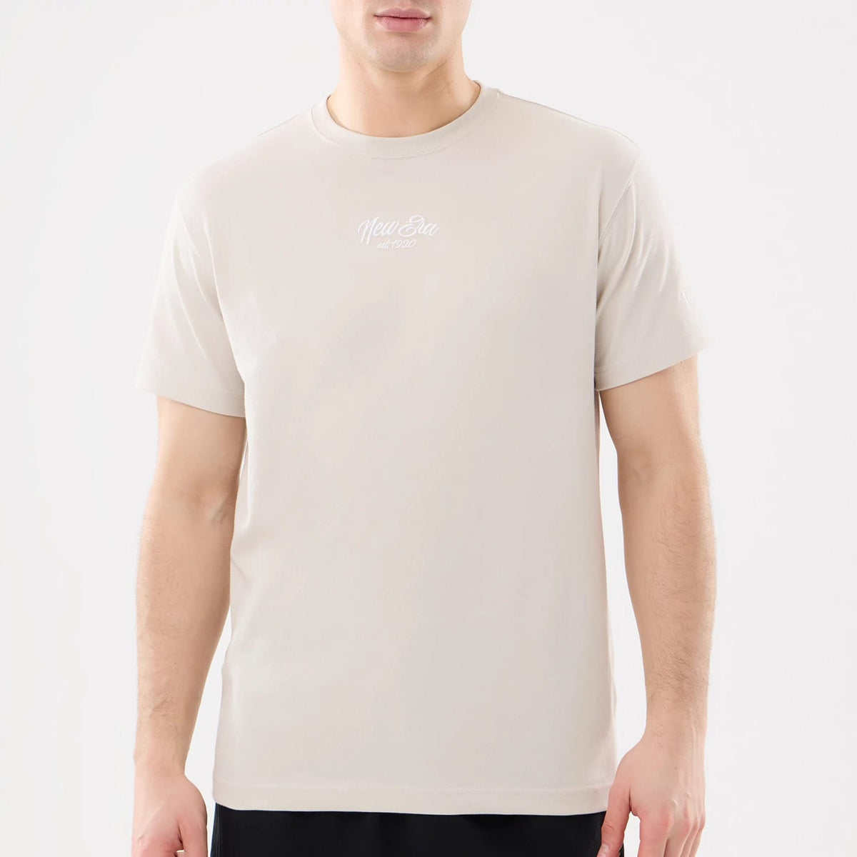 The model is wearing this New Era Resort T-Shirt in natural. 5