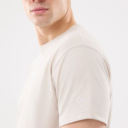 The model is wearing this New Era Resort T-Shirt in natural. 6