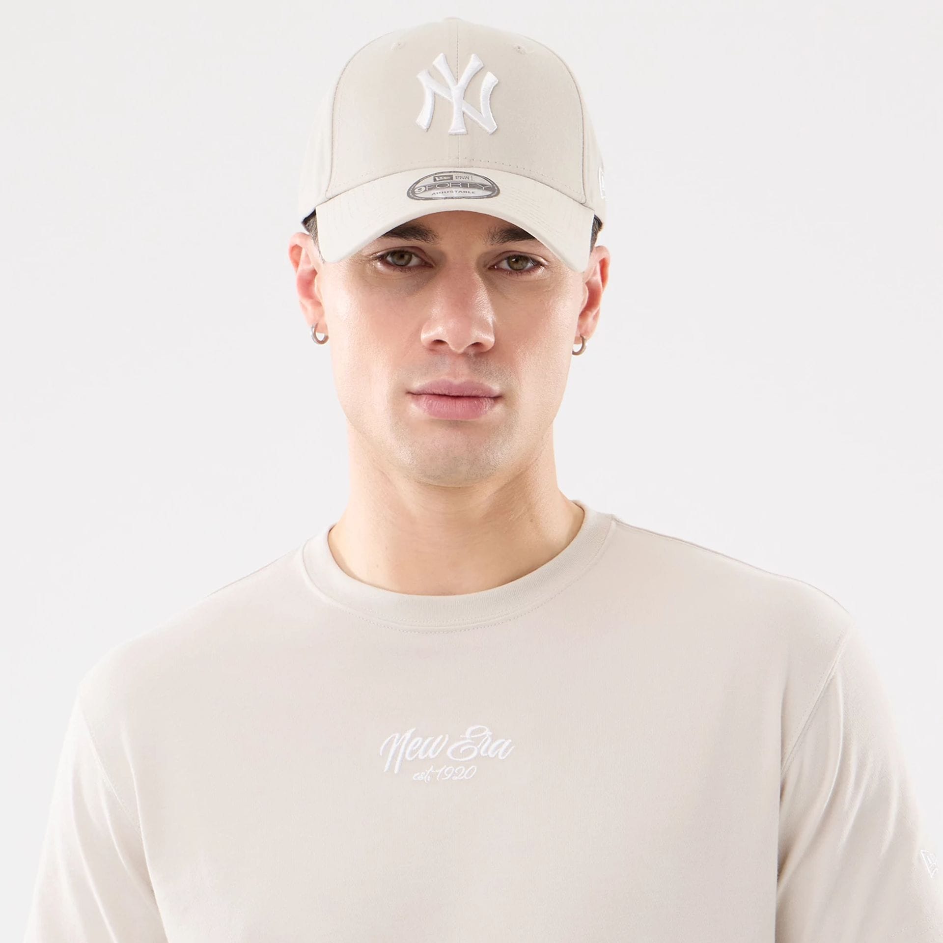 The model is wearing this New Era Resort T-Shirt in natural. 7