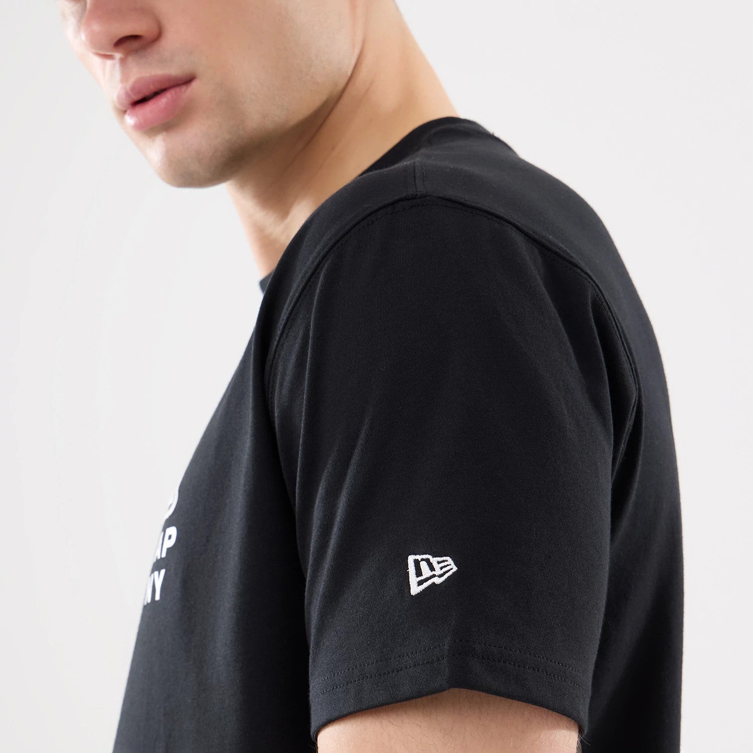 The model is wearing this New Era Outdoor Mountain T-Shirt in black. 4