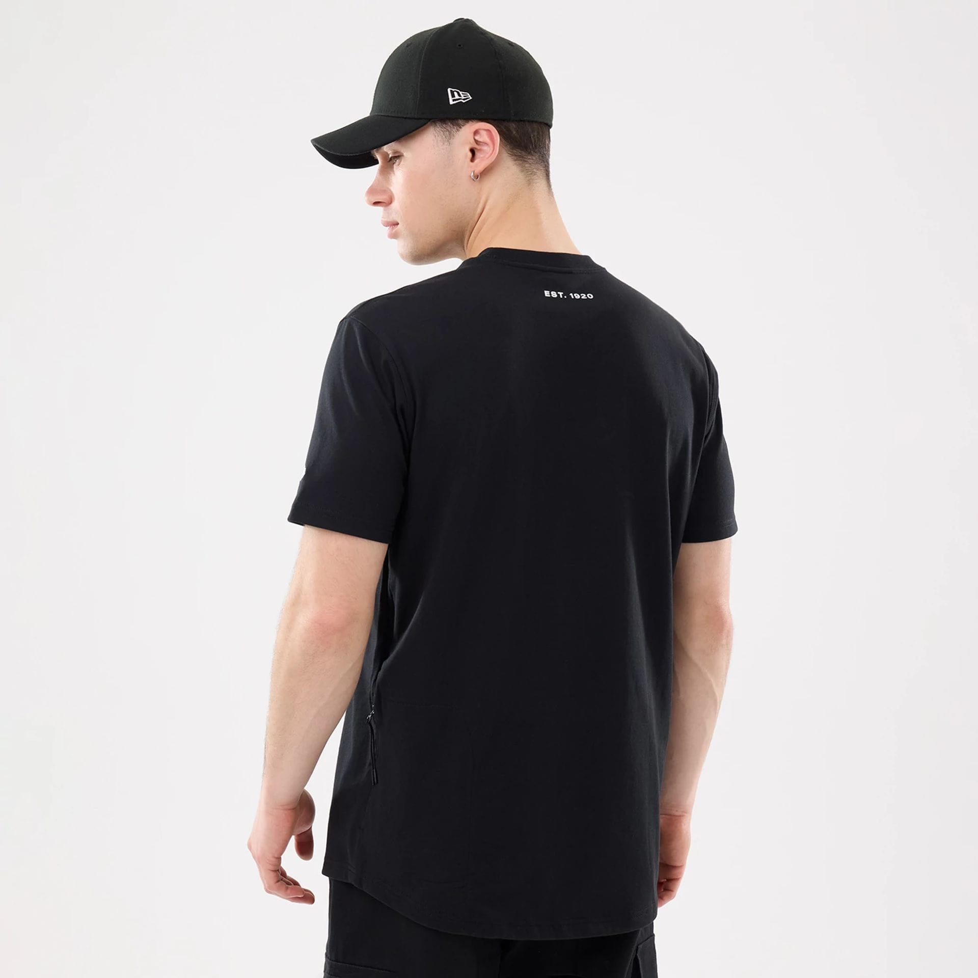 The model is wearing this New Era Outdoor Mountain T-Shirt in black. 2