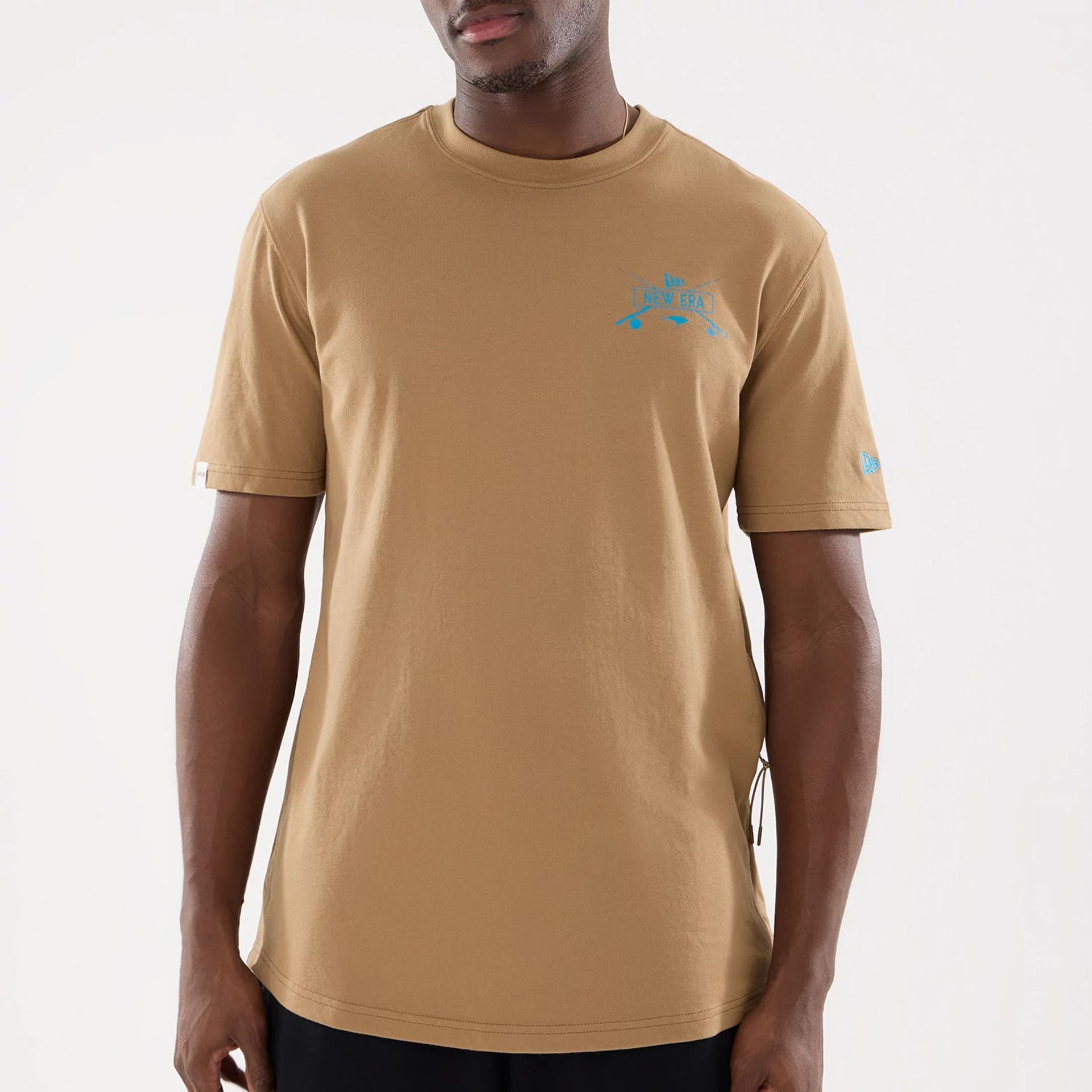 The model is wearing this New Era Outdoor Fishing T-Shirt in Beige. 5