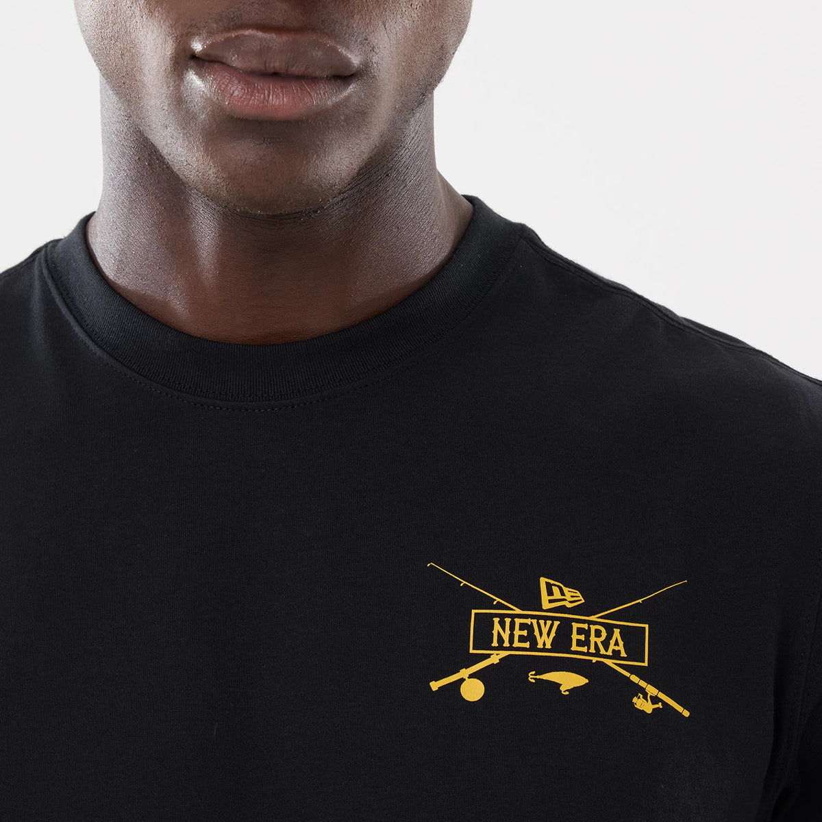 The model is wearing this New Era Outdoor Fishing T-Shirt in black. 3
