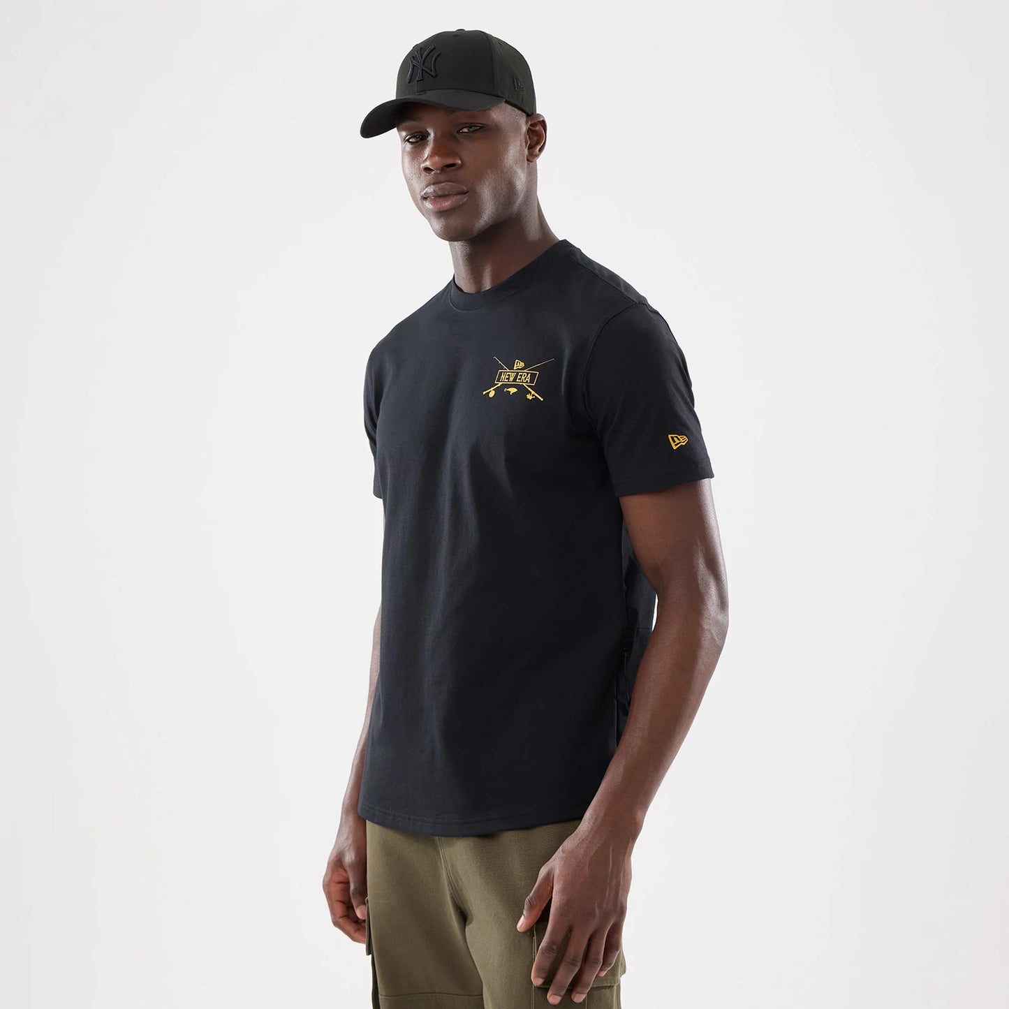 The model is wearing this New Era Outdoor Fishing T-Shirt in black. 1