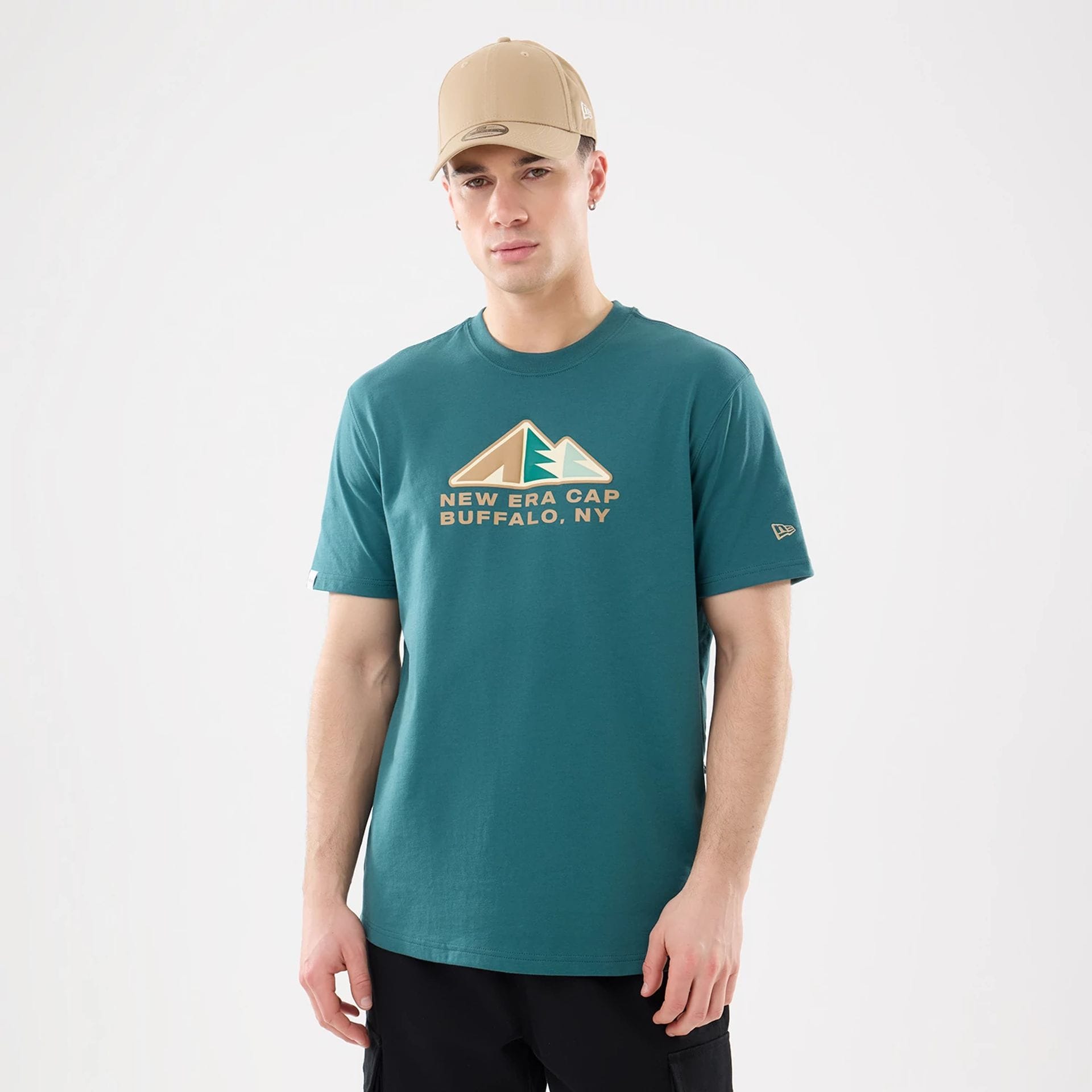 The model is wearing this New Era Outdoor Mountain T-Shirt in dark green. 1
