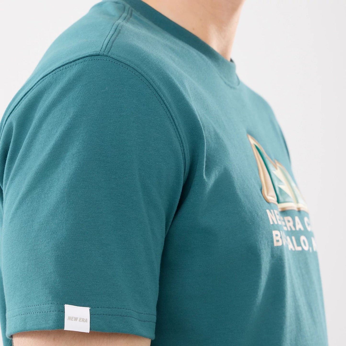The model is wearing this New Era Outdoor Mountain T-Shirt in dark green. 4