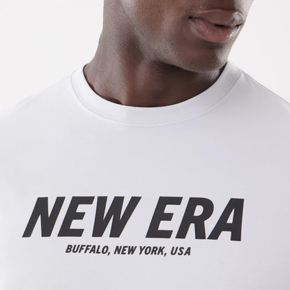 The model is wearing this New Era Basic T-Shirt in white. 3