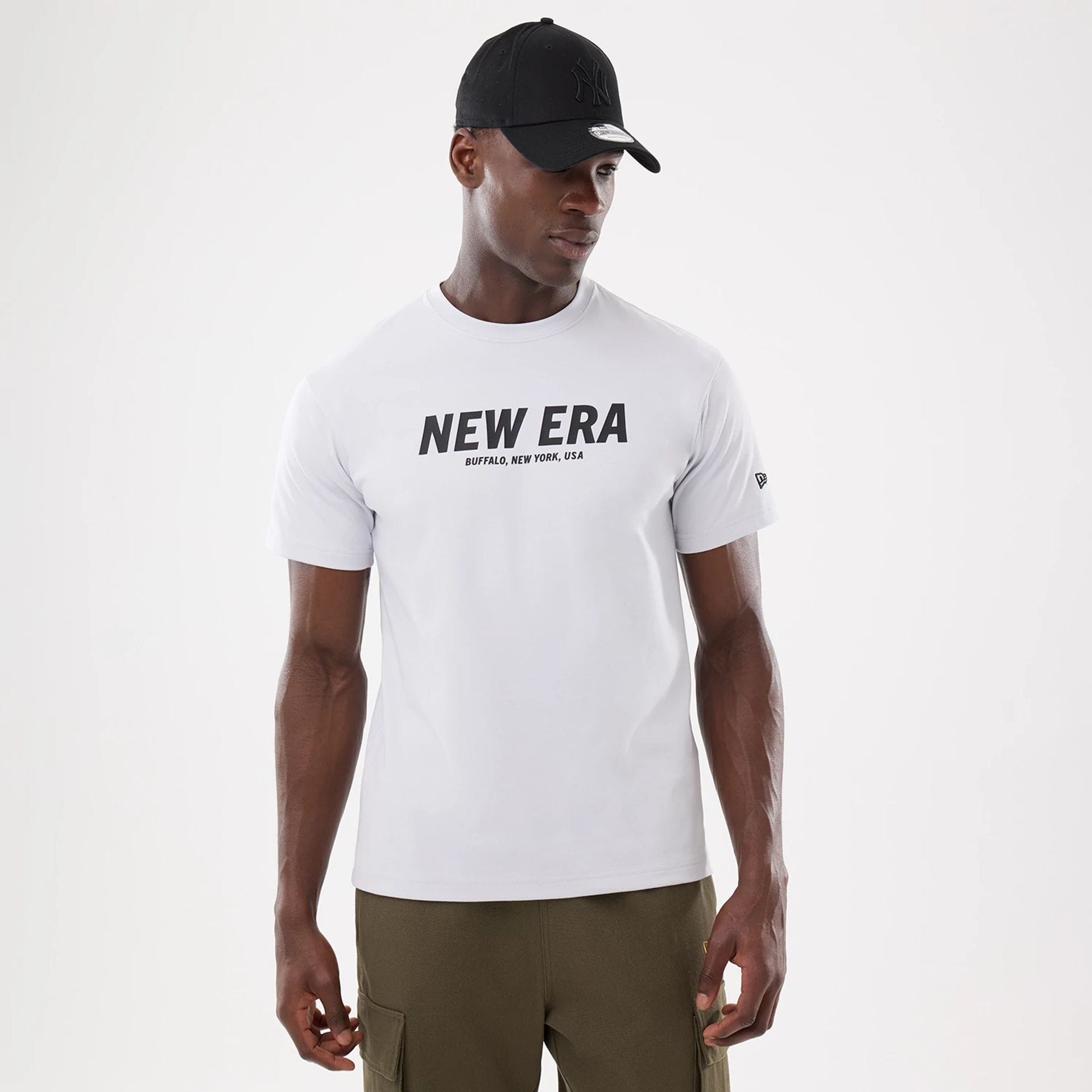 The model is wearing this New Era Basic T-Shirt in white. 1