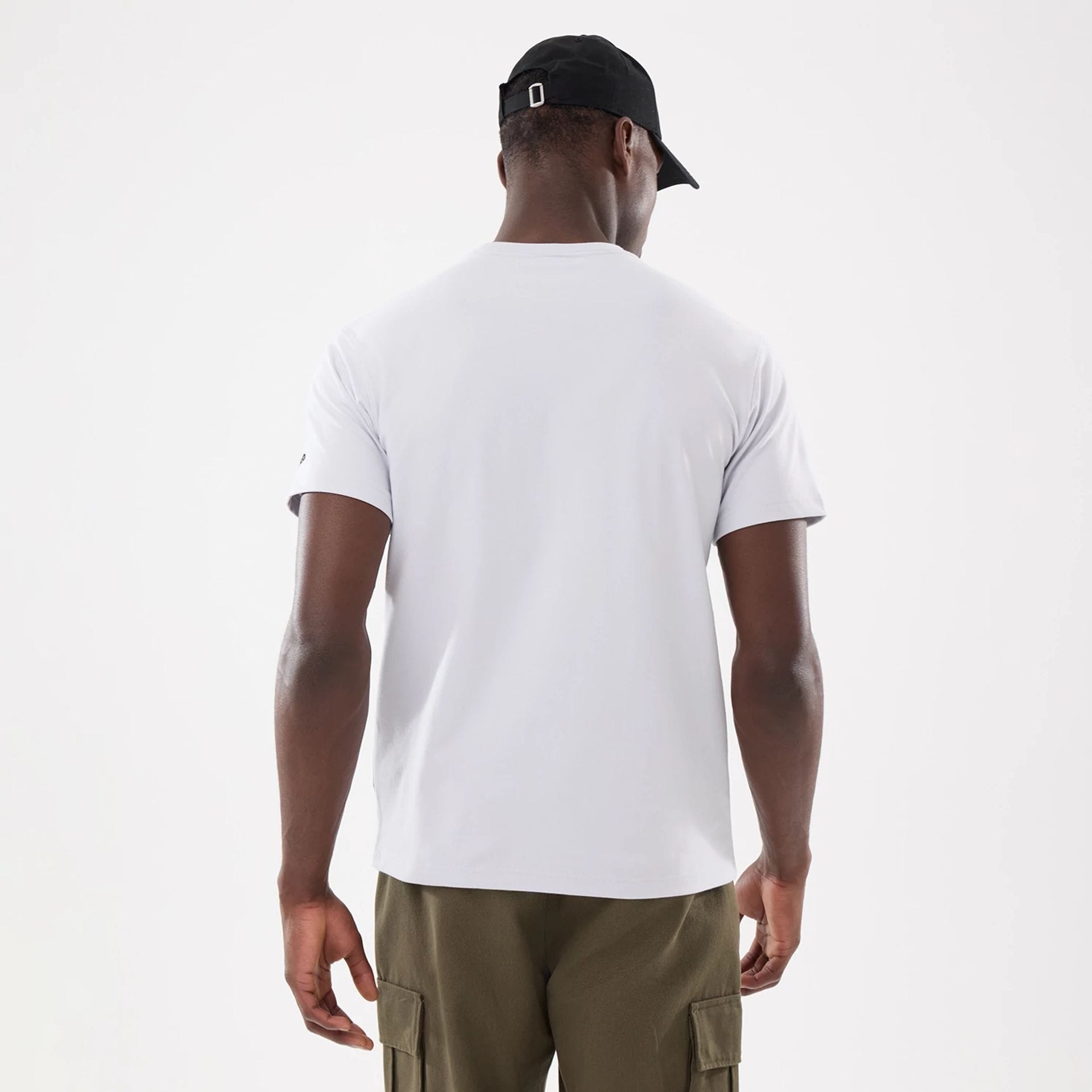 The model is wearing this New Era Basic T-Shirt in white. 2