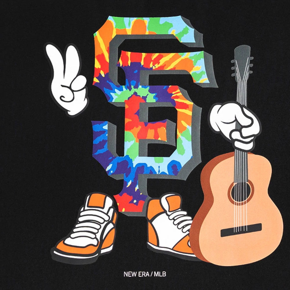 San Francisco Giants MLB Cartoon Black T-Shirt, front view featuring a large colourful tie-dye "SF" graphic with cartoon hands, one holding a guitar, the other in a peace sign gesture, and orange trainers positioned below.