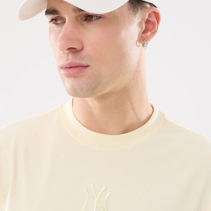The model is wearing this MLB Cartoon New York Yankees T-Shirt in cream. 4