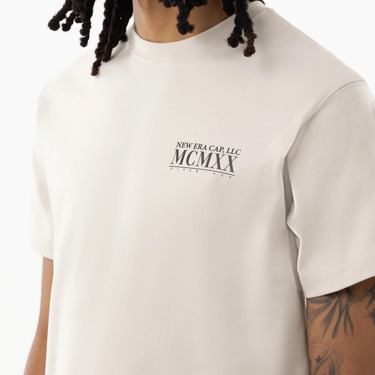 The model is wearing this New Era Heritage T-Shirt in Cream. 3