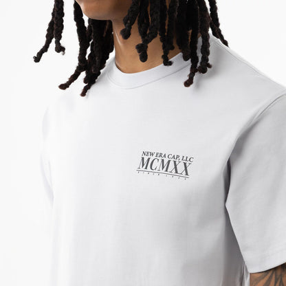 The model is wearing this New Era Heritage T-Shirt in White. 5