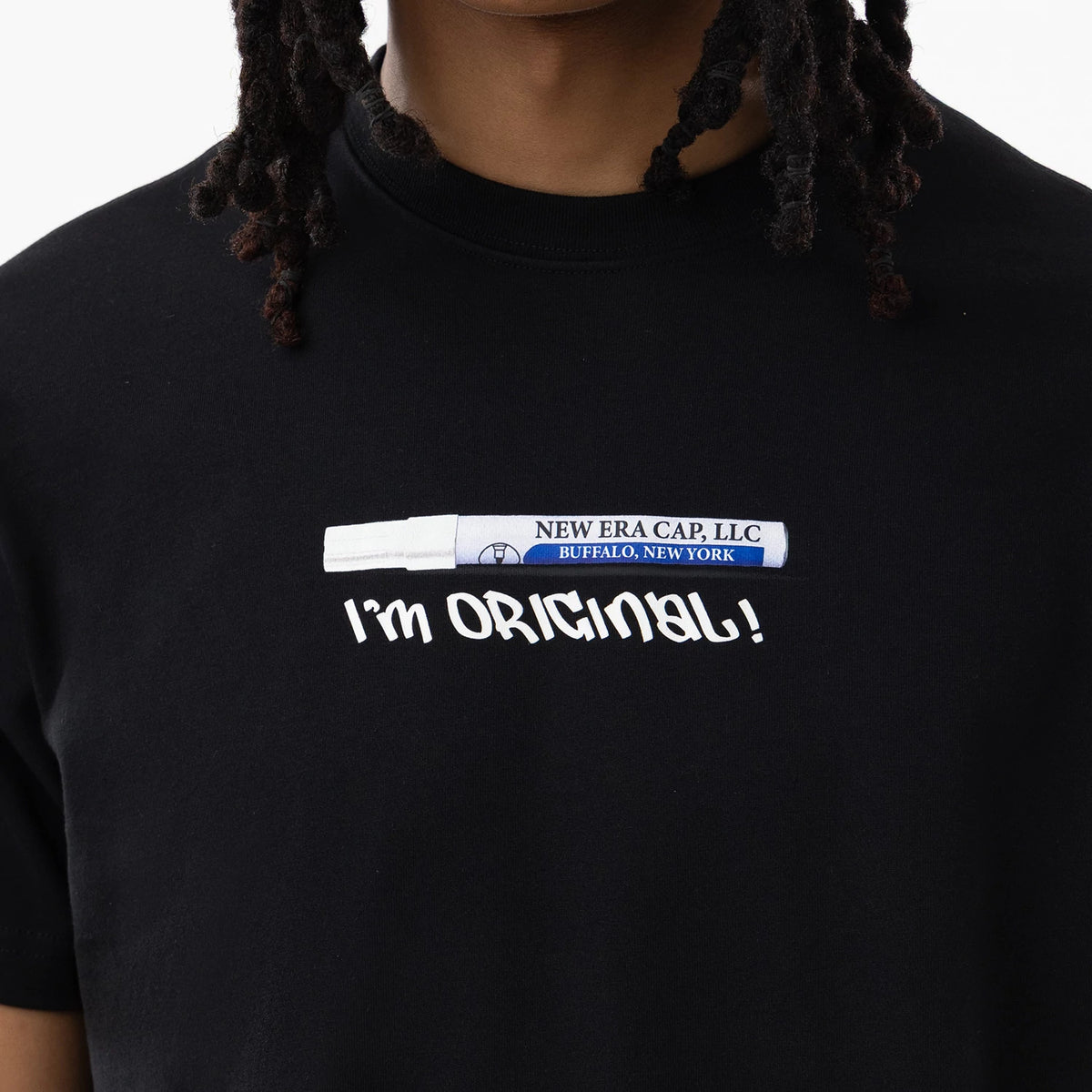 New Era I Am Original Black T-Shirt, front view showing a design resembling a marker pen with the text 'New Era Cap, LLC Buffalo, New York,' above large white 'I’m Original!' lettering printed across the chest.