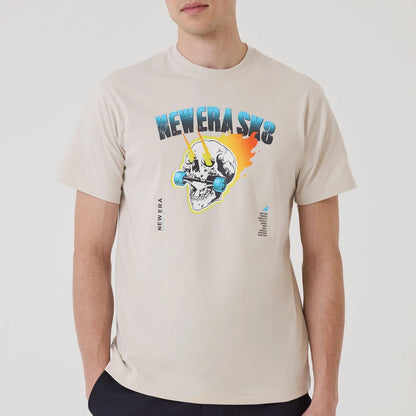 The model is wearing this New Era SK8 Graphic T-Shirt in Cream. 3
