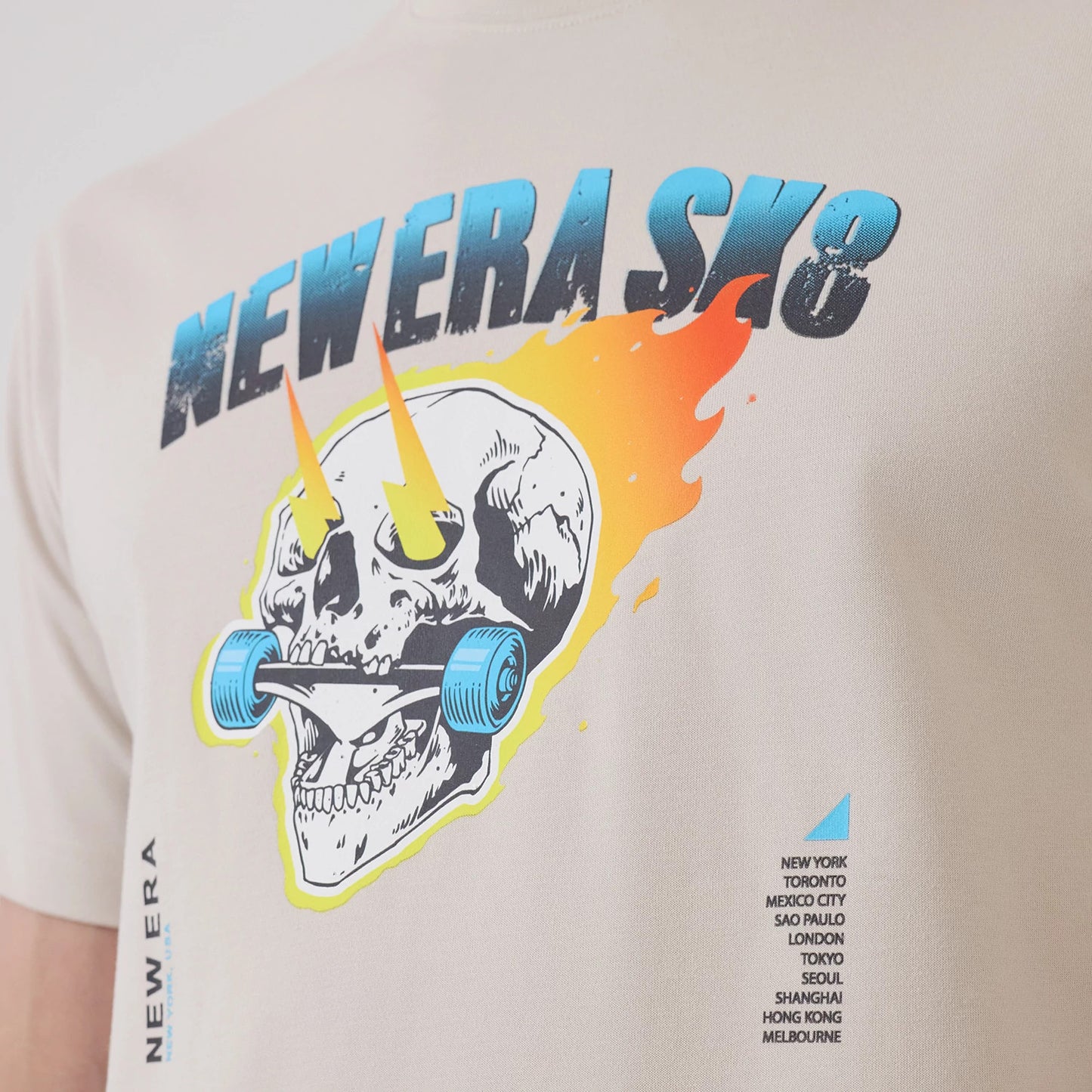 The model is wearing this New Era SK8 Graphic T-Shirt in Cream. 6