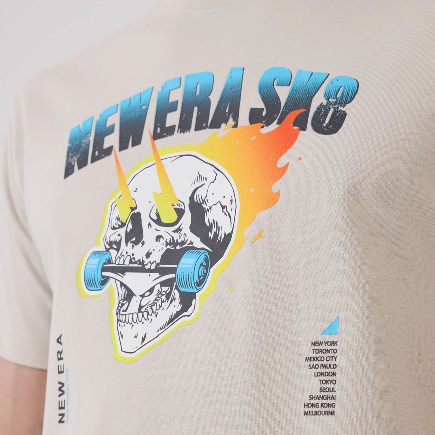 The model is wearing this New Era SK8 Graphic T-Shirt in Cream. 6