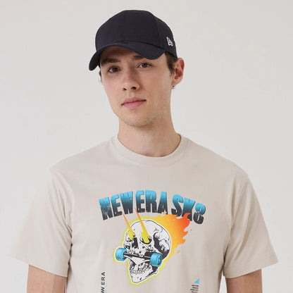 The model is wearing this New Era SK8 Graphic T-Shirt in Cream. 4
