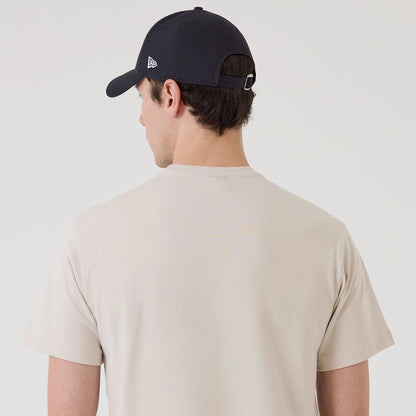 The model is wearing this New Era SK8 Graphic T-Shirt in Cream. 5