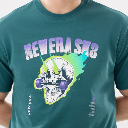 The model is wearing this New Era SK8 Graphic T-Shirt in dark green. 3