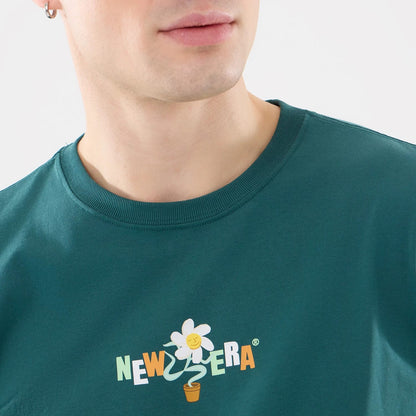 The model is wearing this New Era Earth Day T-Shirt in dark green. 3