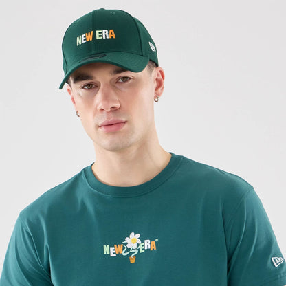 The model is wearing this New Era Earth Day T-Shirt in dark green. 6
