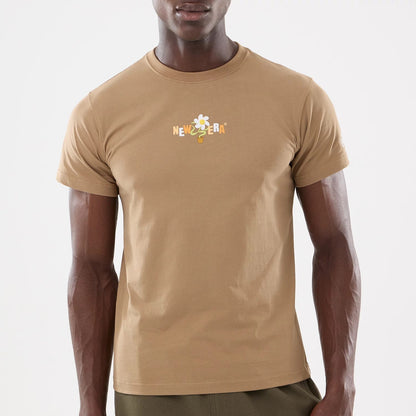 The model is wearing this New Era Earth Day T-Shirt in beige/khaki. 5