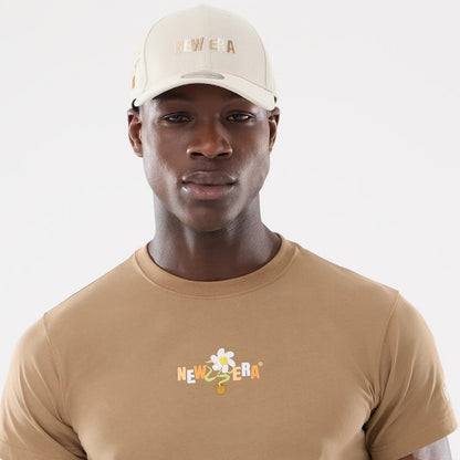 The model is wearing this New Era Earth Day T-Shirt in beige/khaki. 6