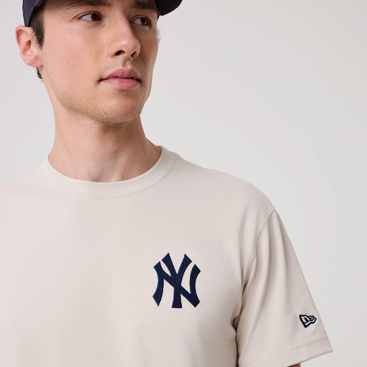 The model is wearing this MLB Banana Graphic New York Yankees T-Shirt in natural. 5