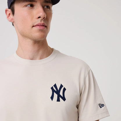 The model is wearing this MLB Banana Graphic New York Yankees T-Shirt in natural. 5